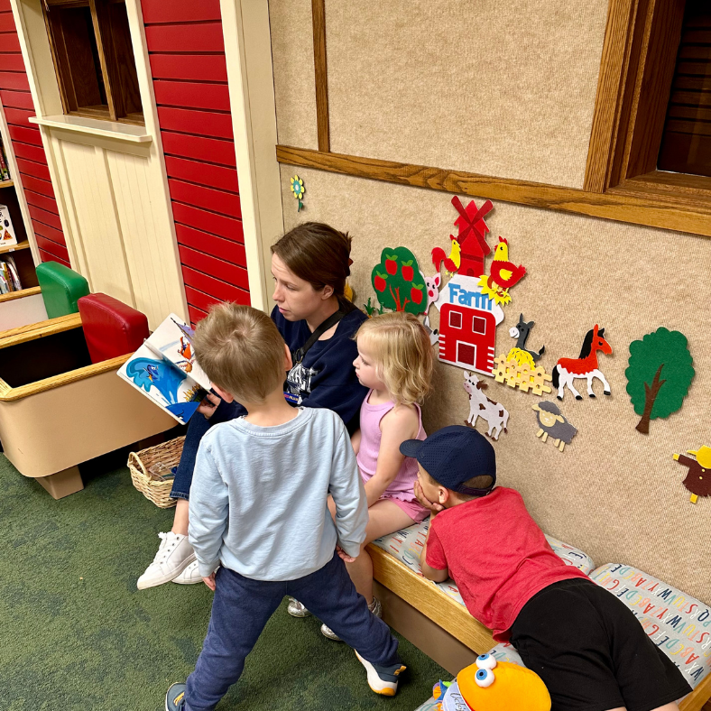 Mom reading to her children